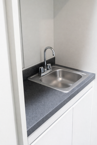 Optional Service Station add-on for Fish Retail Racks with Sink for Fish Bagging and Storage for a Carbon Filter and Air Blower.